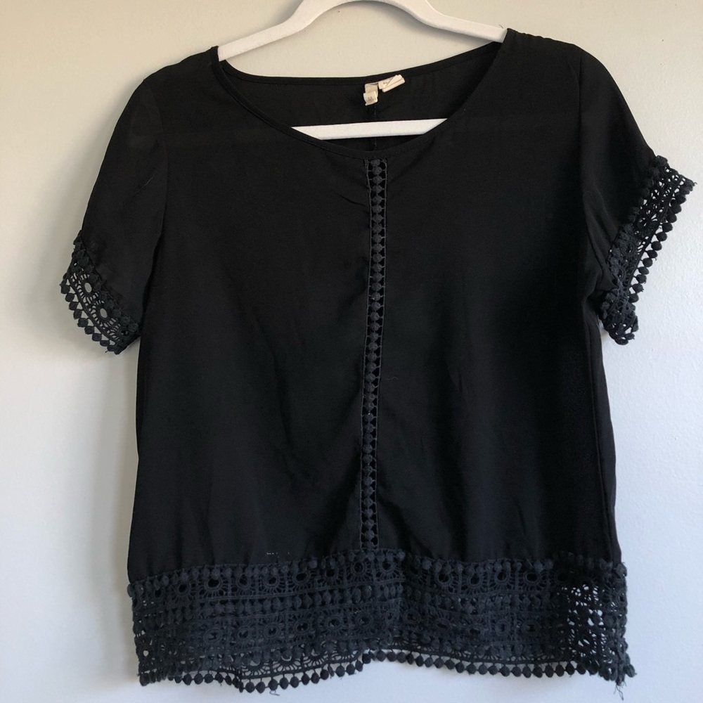 Black blouse with detailed cutouts